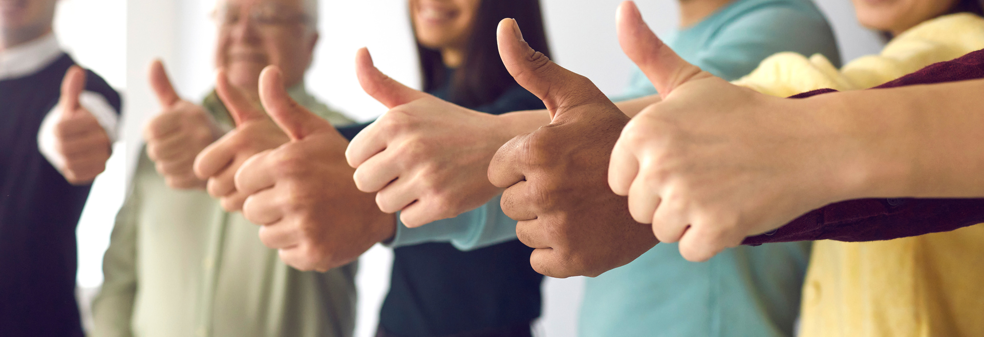 Close up of People of All Ages Showing Thumbs up as a Symbol of Recommendation and Approval.